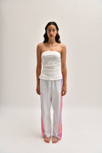 Load image into Gallery viewer, Front image of pink cotton trousers with a relaxed, lightweight fit, styled to resemble linen.
