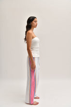 Load image into Gallery viewer, Side image of pink cotton trousers with a relaxed, lightweight fit, styled to resemble linen.
