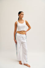 Load image into Gallery viewer, Front image of blue and white cotton trousers with a relaxed, linen-style fit.
