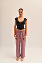 Load image into Gallery viewer, Front image of striped cotton trousers with a relaxed, wide-leg fit, designed to mimic the breezy look of linen.
