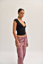 Load image into Gallery viewer, Side image of striped cotton trousers with a relaxed, wide-leg fit, designed to mimic the breezy look of linen.
