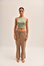 Load image into Gallery viewer, Front image of striped cotton trousers with a relaxed, wide-leg fit, designed to mimic the breezy look of linen.
